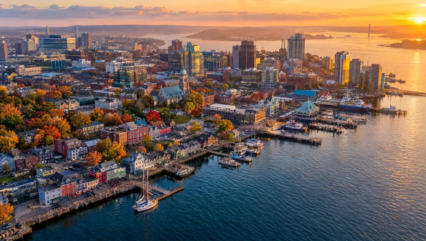 Aerial view of the Halifax waterfront, downtown buildings and harbour at sunset