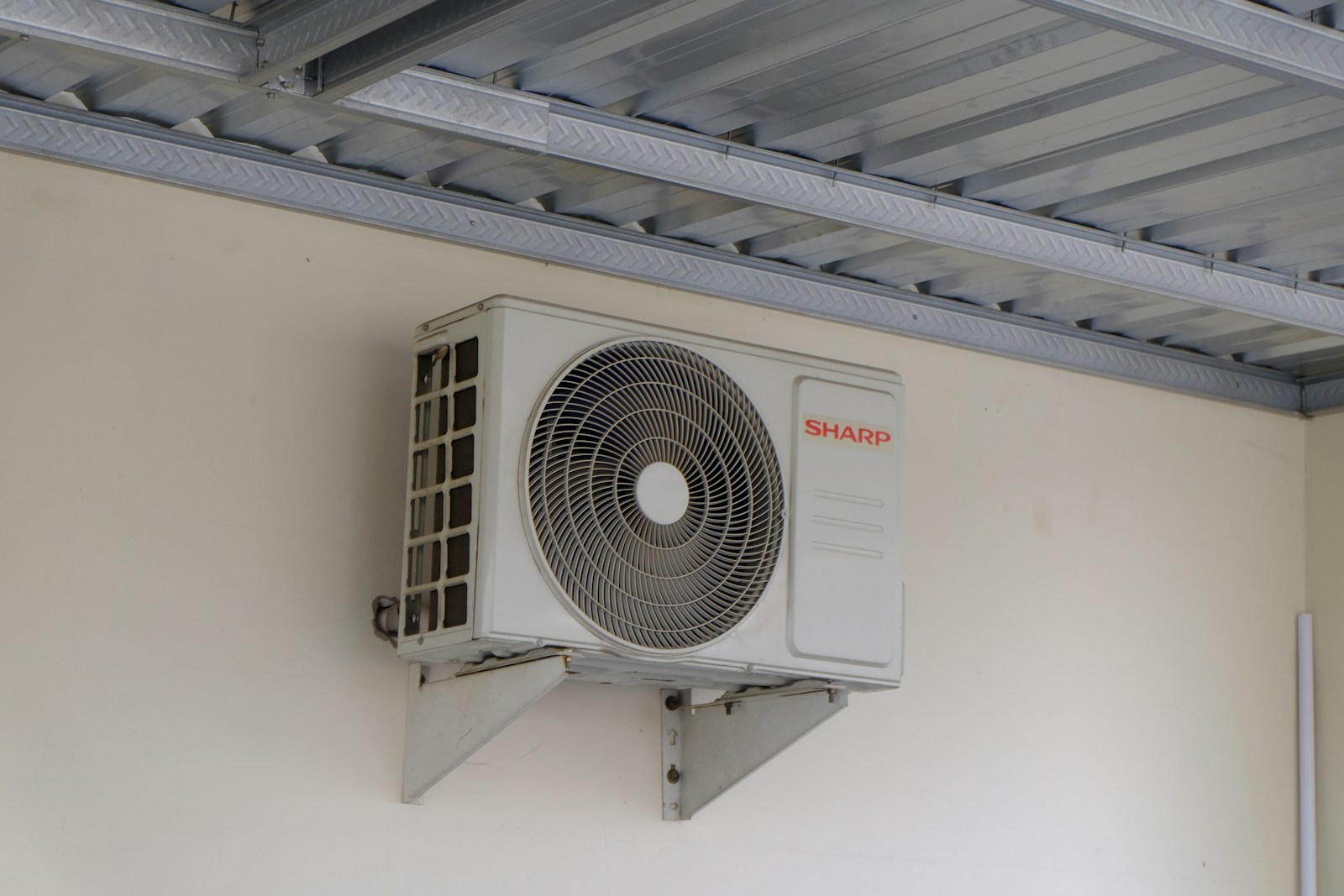 White wall-mounted ductless mini-split indoor unit inside a home